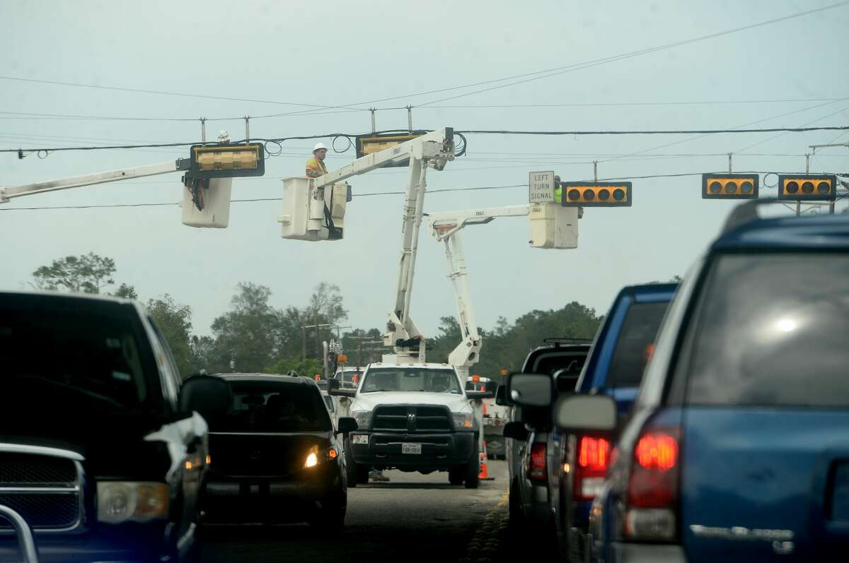 Multiple units repair traffic signals at I-10 and 16th Street in Orange a week after the area was hit with some of the most severe damage in Southeast Texas by Hurricane Laura. Photo taken Thursday, September 3, 2020 Kim Brent/The Enterprise