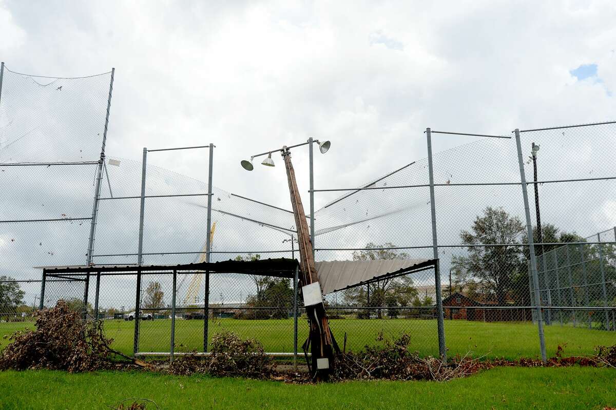 A snapped stadium light pole rests atop a dugout cover in Simmons Field in Orange a week after the area was hit with some of the most severe damage in Southeast Texas by Hurricane Laura. Photo taken Thursday, September 3, 2020 Kim Brent/The Enterprise
