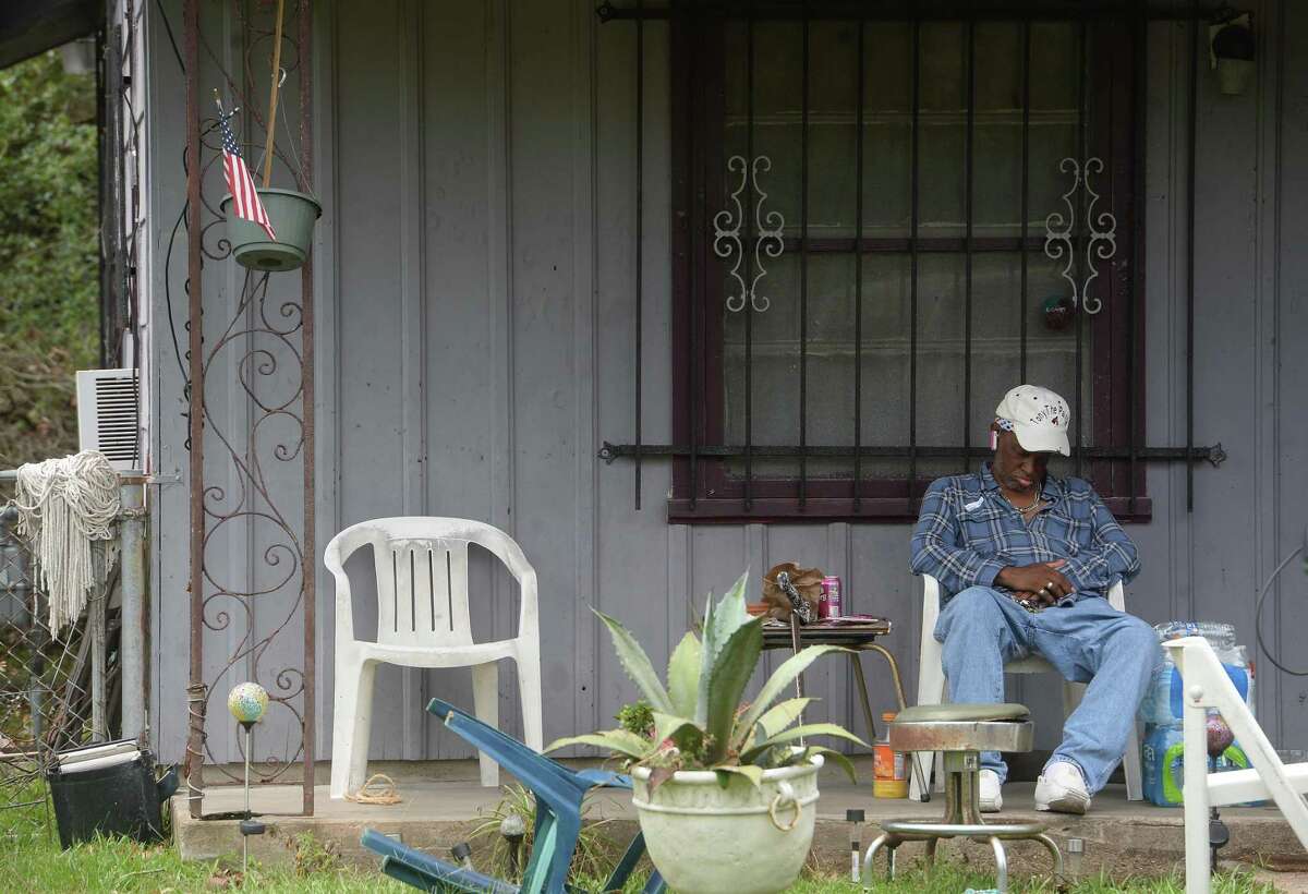 A man sleeps o his front porch amid ongoing power outages in Orange a week after the area was hit with some of the most severe damage in Southeast Texas by Hurricane Laura. Photo taken Thursday, September 3, 2020 Kim Brent/The Enterprise