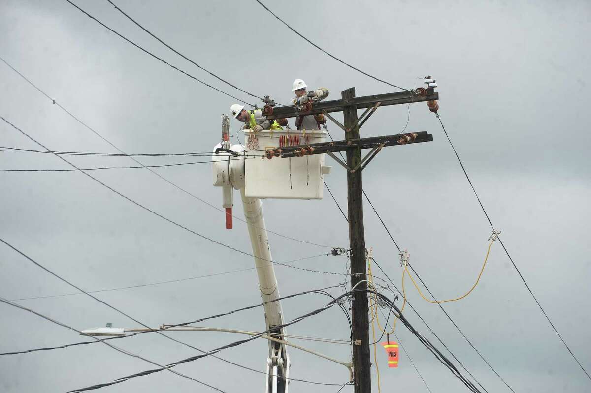 Electric workers make repairs to a powerline in Orange a week after the area was hit with some of the most severe damage in Southeast Texas by Hurricane Laura. Photo taken Thursday, September 3, 2020 Kim Brent/The Enterprise