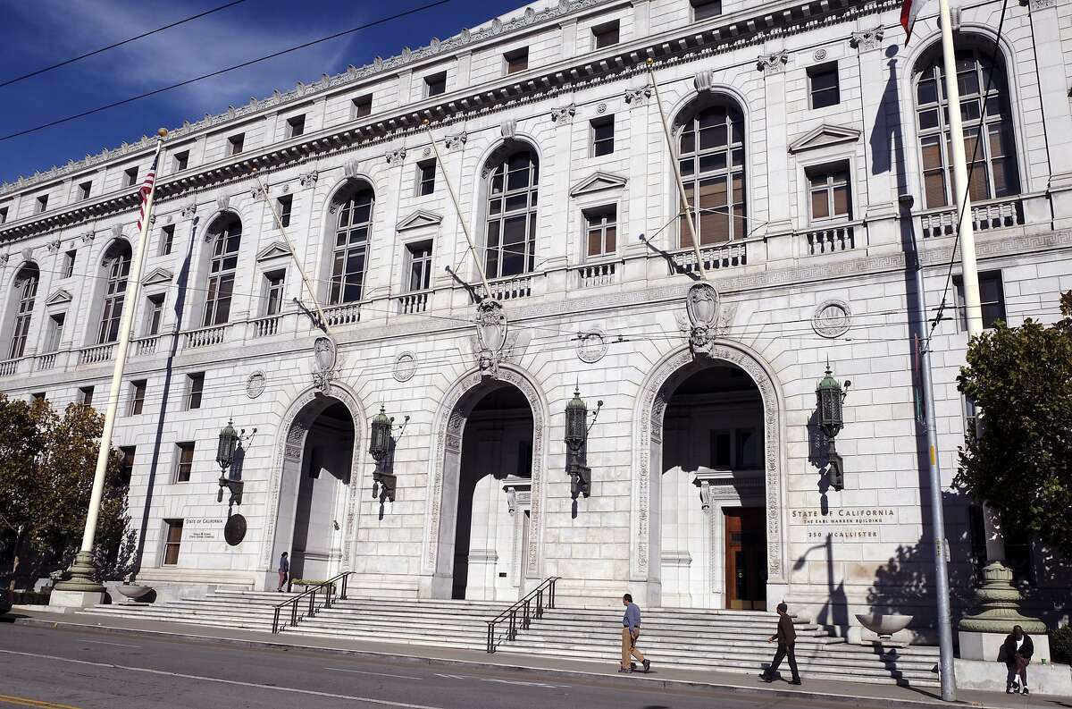 FILE - In this Jan. 2, 2019, file photo, people walk past the Earl Warren Building that houses the California Supreme Court in San Francisco. Los Angeles County must pay a full $8 million damages award to the family of a Black man whose death evoked the more resent death of George Floyd in Minneapolis, the California Supreme Court ruled Monday, Aug. 10, 2020. While subduing Darren Burley in 2012, Los Angeles sheriff's deputies "used their knees to pin him to the ground with as much body weight as possible," according to the court's unanimous ruling. (AP Photo/Eric Risberg, File)
