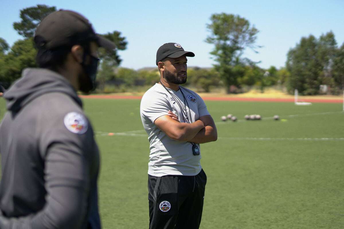 Oakland Roots Head Coach Jordan Ferrell conducts a practice at the College of Alameda.