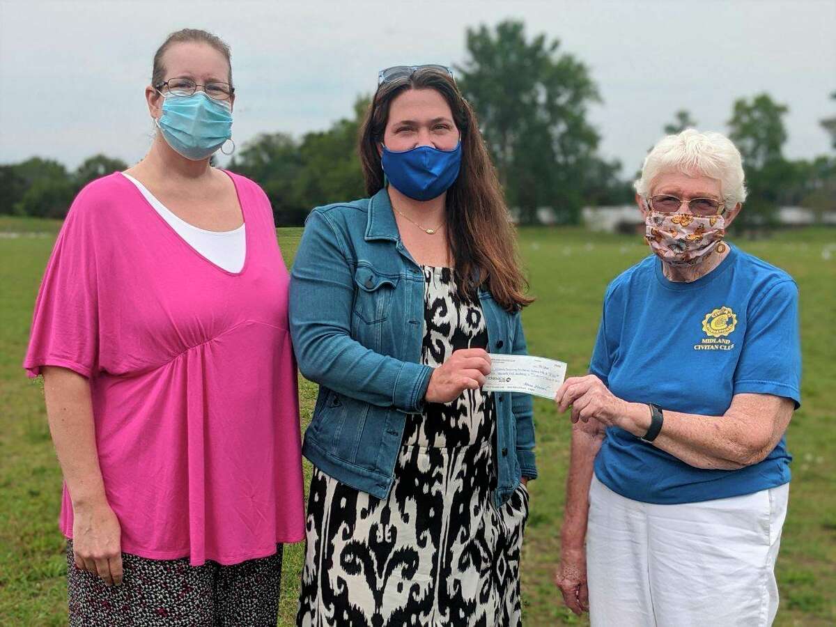From left, Midland Civitan Club Treasurer Beckie Bradshaw and Club President Ginny Baker safely present a check for $2,500 to support The Middle of the Mitt Miracle Field to Marcie Post, Recreation Manager for Midland Parks and Recreation. (Photo provided)