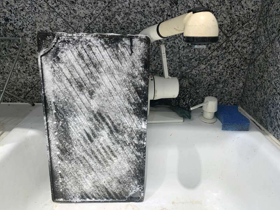 After a soak, I dusted the pan with baking soda and scrubbed with steel wool. Photo: Ryan Craggs