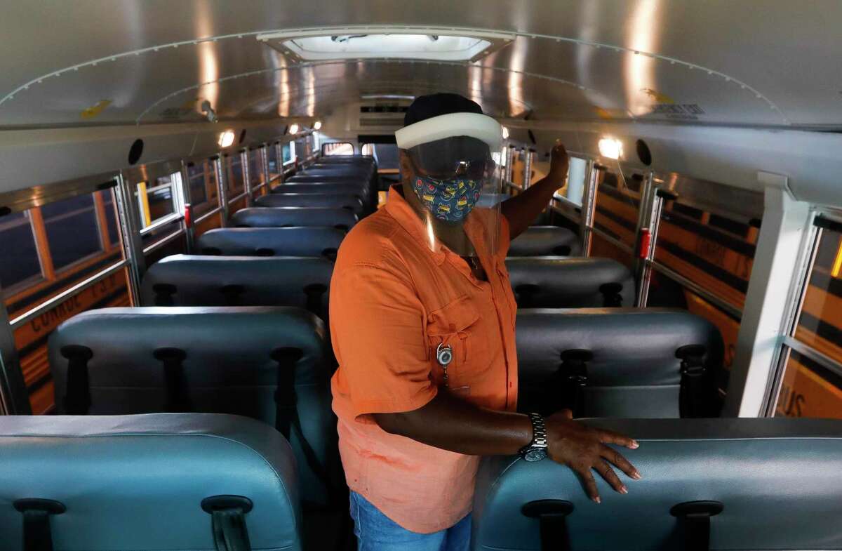 Conroe ISD bus driver Curtiss Chambers talks about new safety and social distancing measures such as loading students back to front, incorporate additional air flow while transporting students and hand sanitizing as the district prepares to welcome students back to in-person school on Sept. 8.