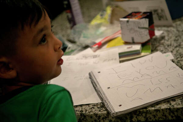 Aiden Dyer, 5, wrote a note to his "Mamá," Leonor "Nora" Rangel while his mother and other family members talked to her over FaceTime.