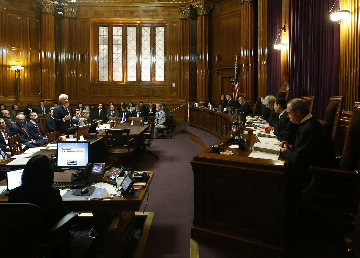 Supervising Deputy Attorney General Jay Russell, presents the state's arguments before the California Supreme Court opposing a lawsuit filed by the California Republican Party to overturn a recently approved state law requiring presidential candidates to disclose their tax returns in order to be of the state's primary ballot, in Sacramento, Calif., Wednesday, Nov. 6, 2019. The law, if upheld, is intended to force President Donald Trump to release his tax returns before California's primary election that will be held in March 2020. (AP Photo/Rich Pedroncelli, Pool)
