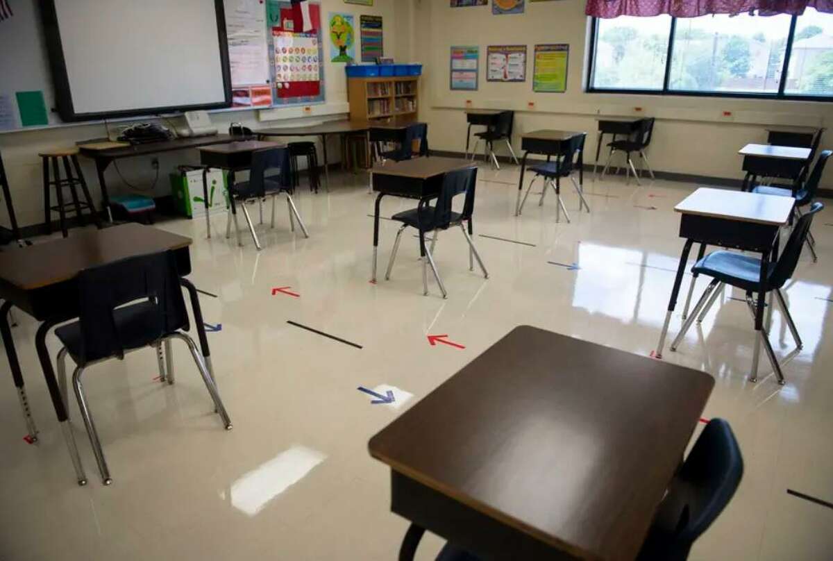 Desks are spaced out in a classroom at Ott Elementary School in San Antonio. Experts say mitigation measures will be critical to preventing coronavirus outbreaks.