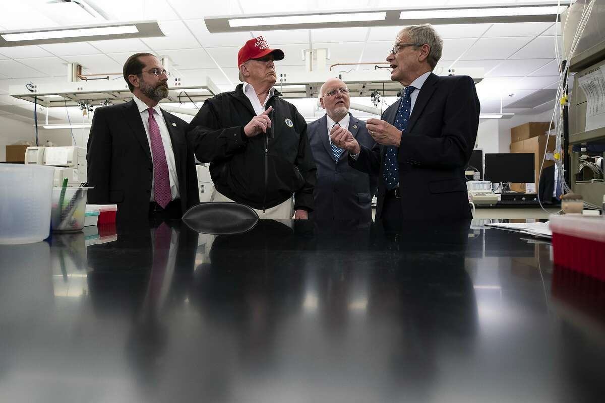 President Donald Trump speaks during a meeting with Health and Human Services Secretary Alex Azar, left, Centers for Disease Control and Prevention Director Robert Redfield, and Associate Director for Laboratory Science and Safety Steve Monroe, about the coronavirus at the Centers for Disease Control and Prevention, Friday, March 6, 2020 in Atlanta. (AP Photo/Alex Brandon)