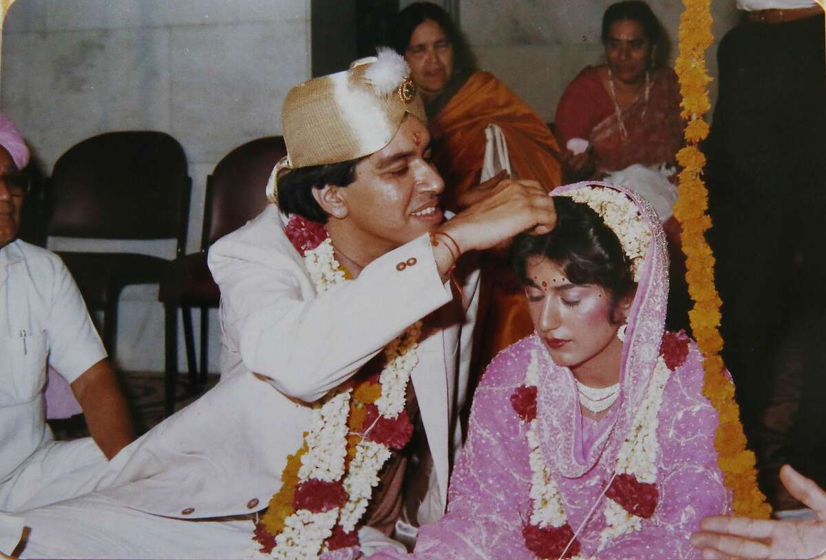Atulya Sarin (left) and Seema Sarin are seen in an archival photo on their wedding day in July 1988. The Sarins came together through an arranged marriage.