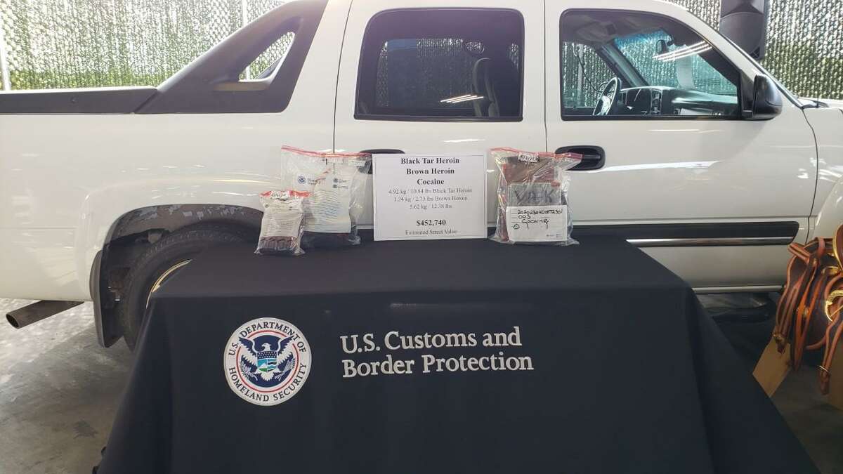 U.S. Customs and Border Protection officers said they they seized cocaine, black tar heroin and brown heroin from this white Chevrolet Avalanche.