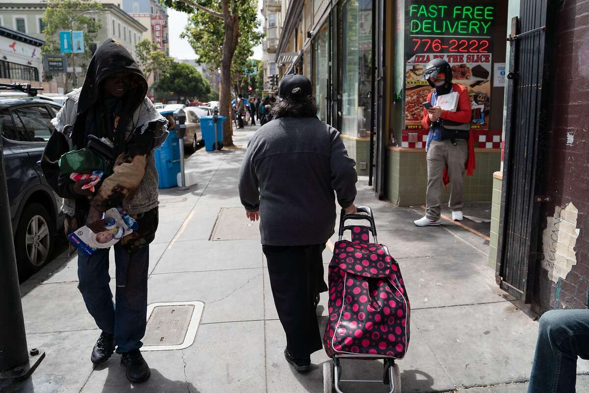 Rosa Alvarado, 58, walks up Ellis Street on her way to pick up a prescription from Walgreens in San Francisco, Calif., on Monday, August 10, 2020.