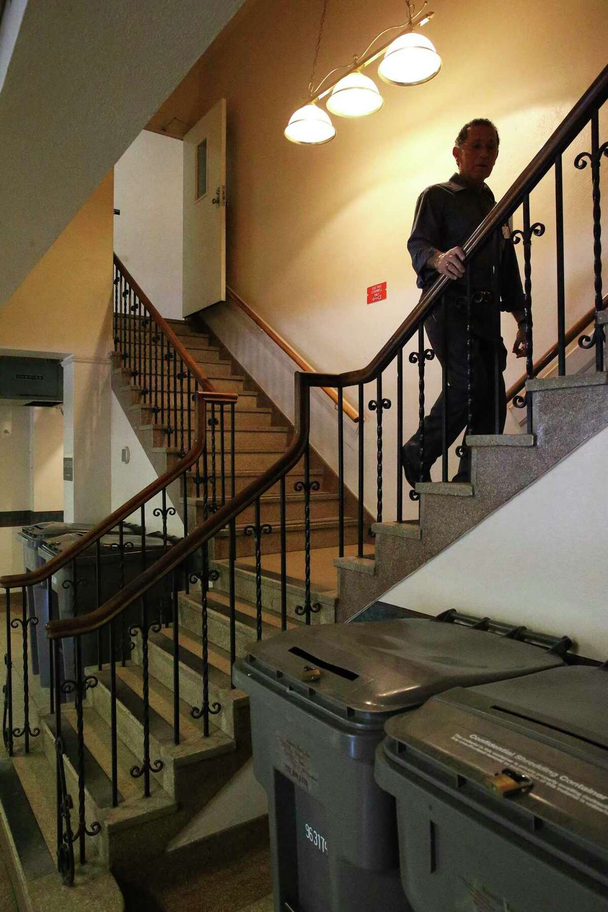 Superintendent Robert C. Arizpe heads upstairs in an old building now used for administrative purposes as 80 percent of buildings at the State Hospital in San Antonio are considered to be in critical condition on July 21, 2016.