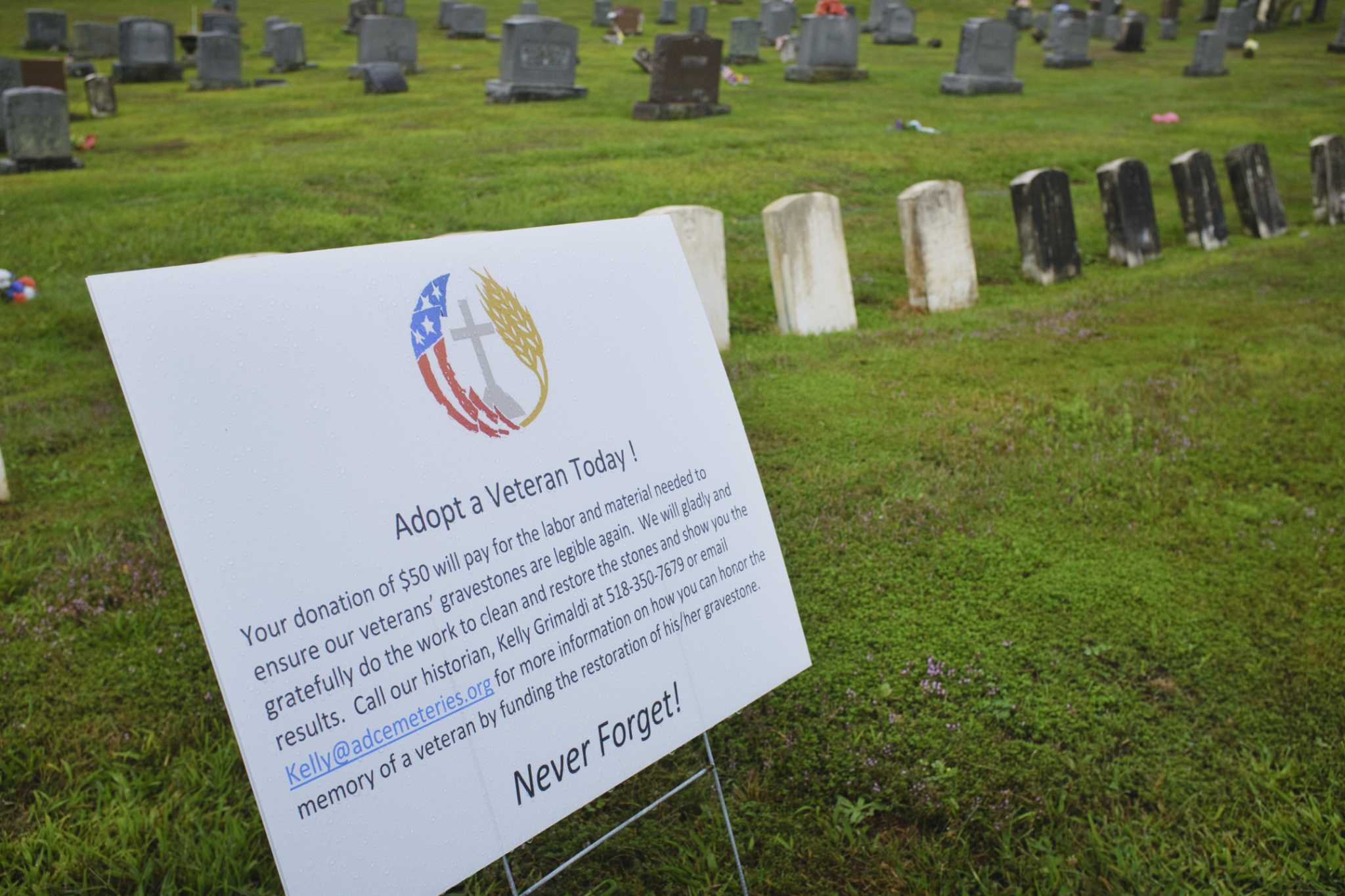Cleaning veterans headstones in Troy salutes their service