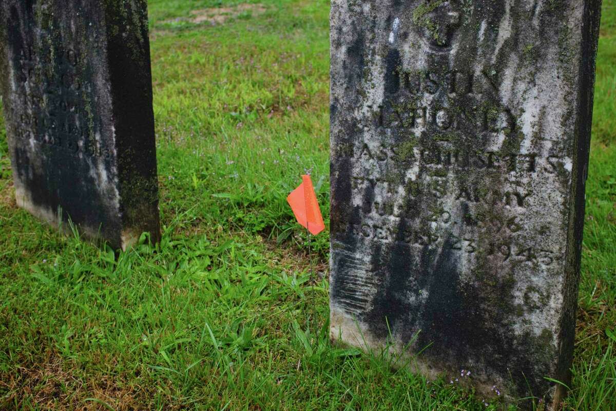 Cleaning veterans headstones in Troy salutes their service