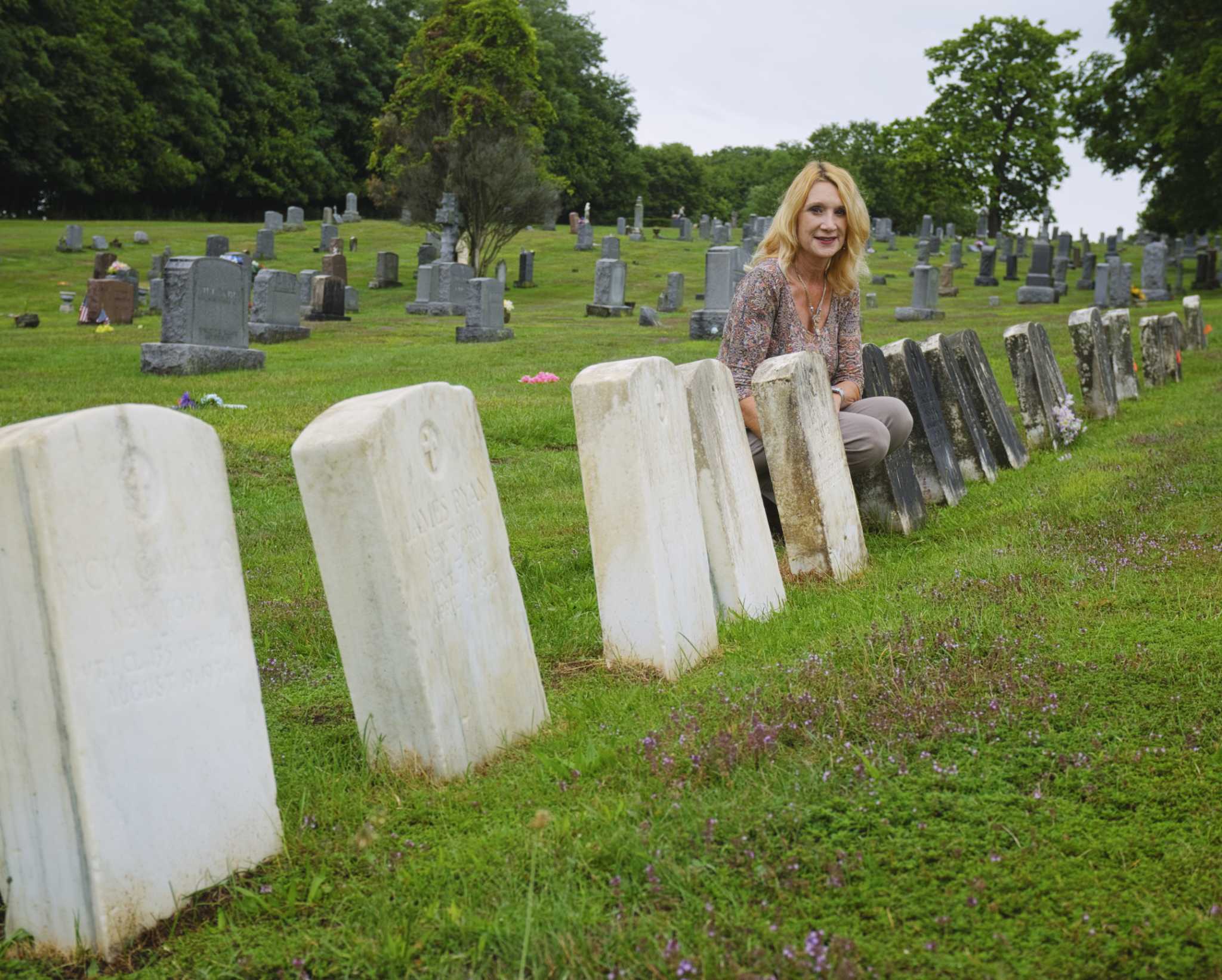 Cleaning veterans headstones in Troy salutes their service