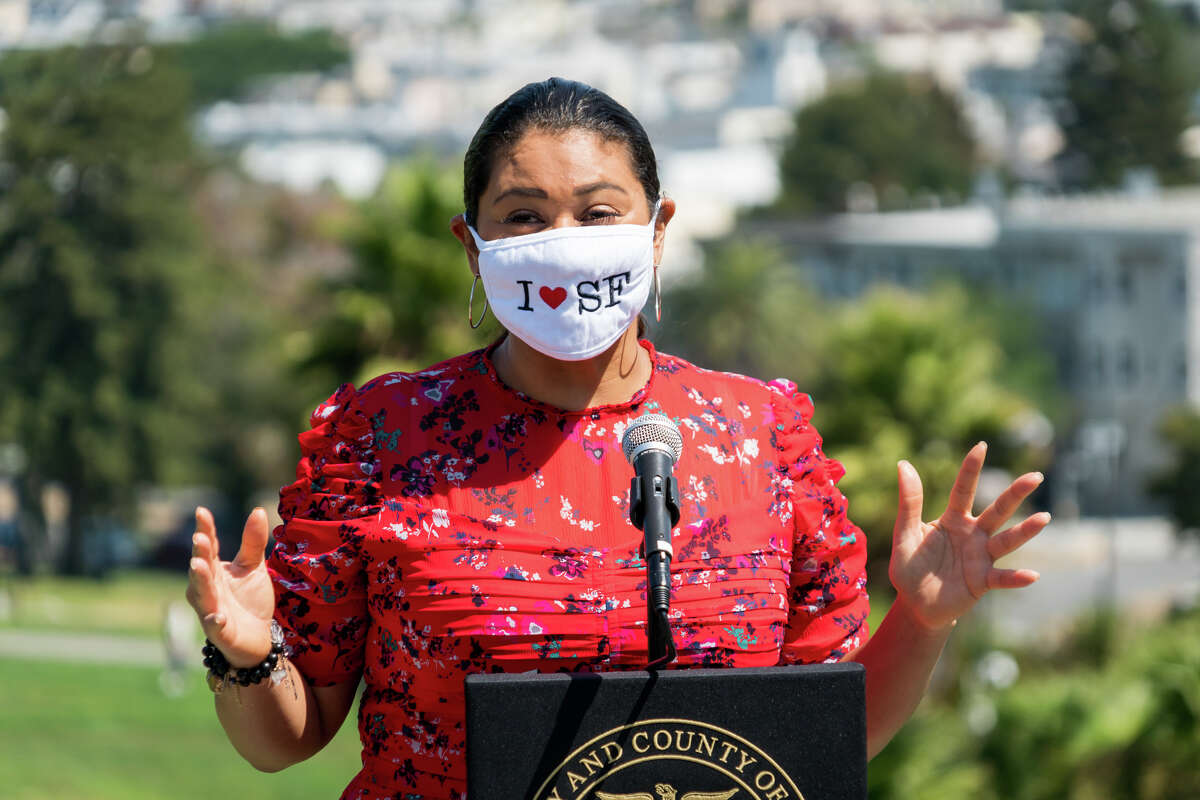 San Francisco Mayor London Breed wears a face mask while speaking at a press conference before the event in Dolores Park.