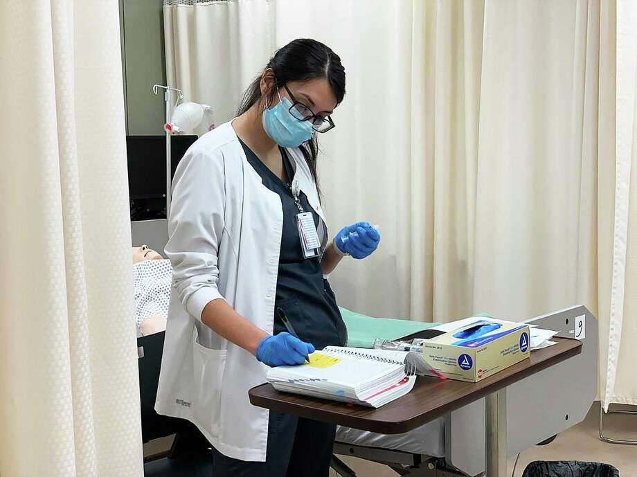 Lone Star College nursing students mask up during training as they  hone their skills in the new BSN, bachelor of science in nursing program. Photo: Submitted