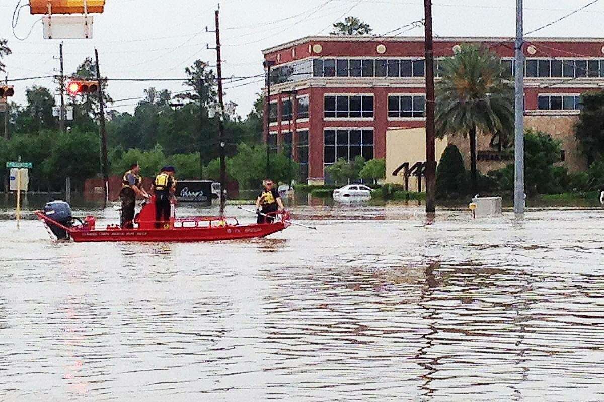 A search and rescue mission underway during the historic Harvey flooding in front of an office building on Cypresswood Drive where Congressman Crenshaw now has an office.
