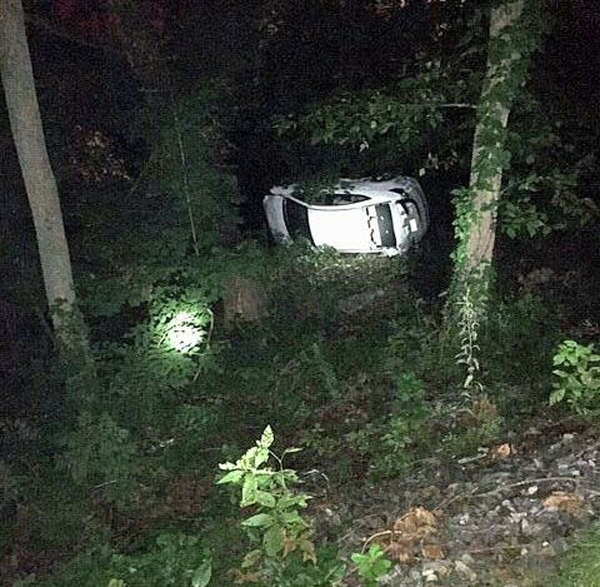 A car that veered off a Merritt Parkway exit ended up in the Norwalk River early Saturday morning, according to Deputy Fire Chief Edward Prescott. Prescott, who estimated the fall to be about 60 feet, said the driver of the car was not seriously injured. The driver, who was not identified, was transported to Norwalk Hospital to be examined for any injuries.