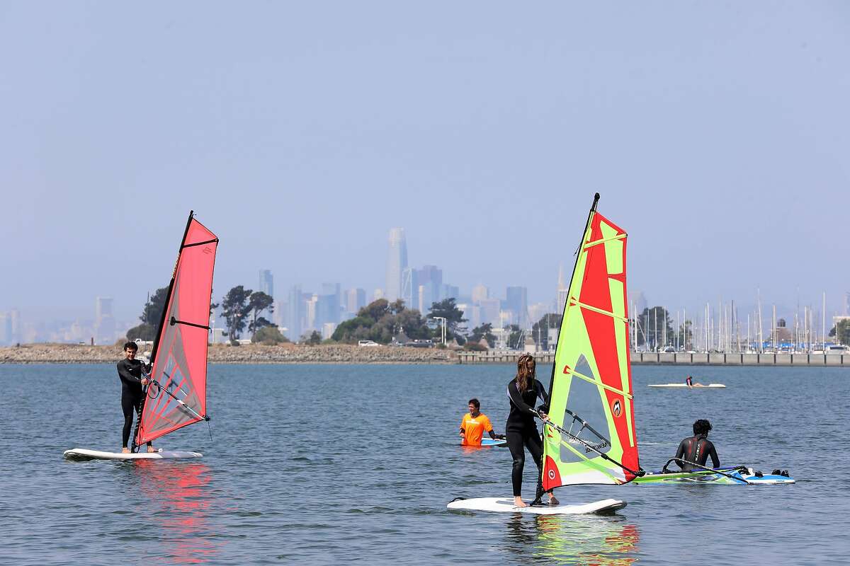 People wind surf at Robert M. Crown Memorial Beach on Saturday, September 5, 2020, in Alameda, Calif. The activity keeps people cool during the hot Labor Day Weekend.