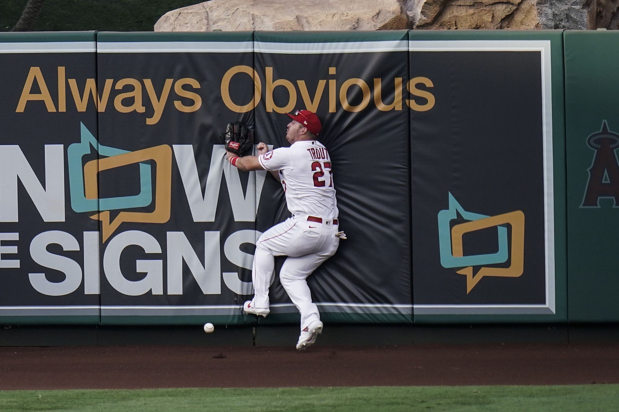 Los Angeles Angels center fielder Mike Trout #27 is greeted at