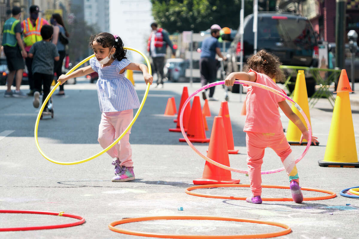 Kids play on the 200 block of Turk Street that was closed to vehicular traffic. The Tenderloin Community Benefit District (TLCBD), SFMTA, and the Livable Cities program collaborated to start the Play Streets program on the 200 block of Turk Street in the Tenderloin neighborhood of San Francisco on Sept. 5, 2020.