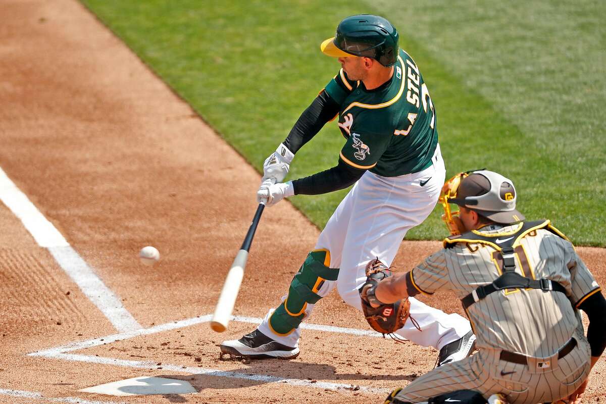 Oakland Athletics' Tommy La Stella doubles in 1st inning against San Diego Padres during MLB game at Oakland Coliseum in Oakland, Calif., on Sunday, September 6, 2020.