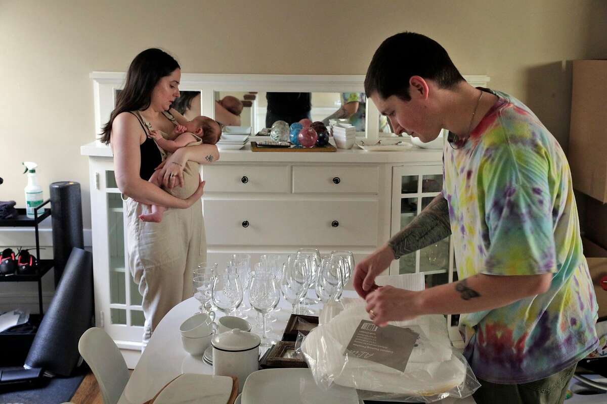 Blake and Erica Johnston with their baby Ellis, packing to move in their apartment in San Francisco, Calif., on Sunday, September 6, 2020. The couple decided to take advantage of the willingness of their employers to work remotely and decided to move to Austin, Texas to be closer to family.