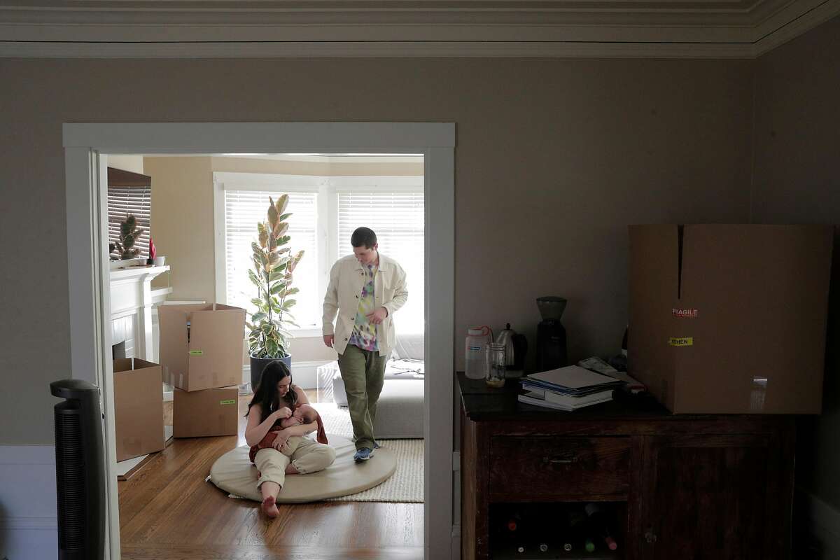 Blake and Erica Johnston with their baby Ellis, packing to move in their apartment in San Francisco, Calif., on Sunday, September 6, 2020. The couple decided to take advantage of the willingness of their employers to work remotely and decided to move to Austin, Texas to be closer to family.