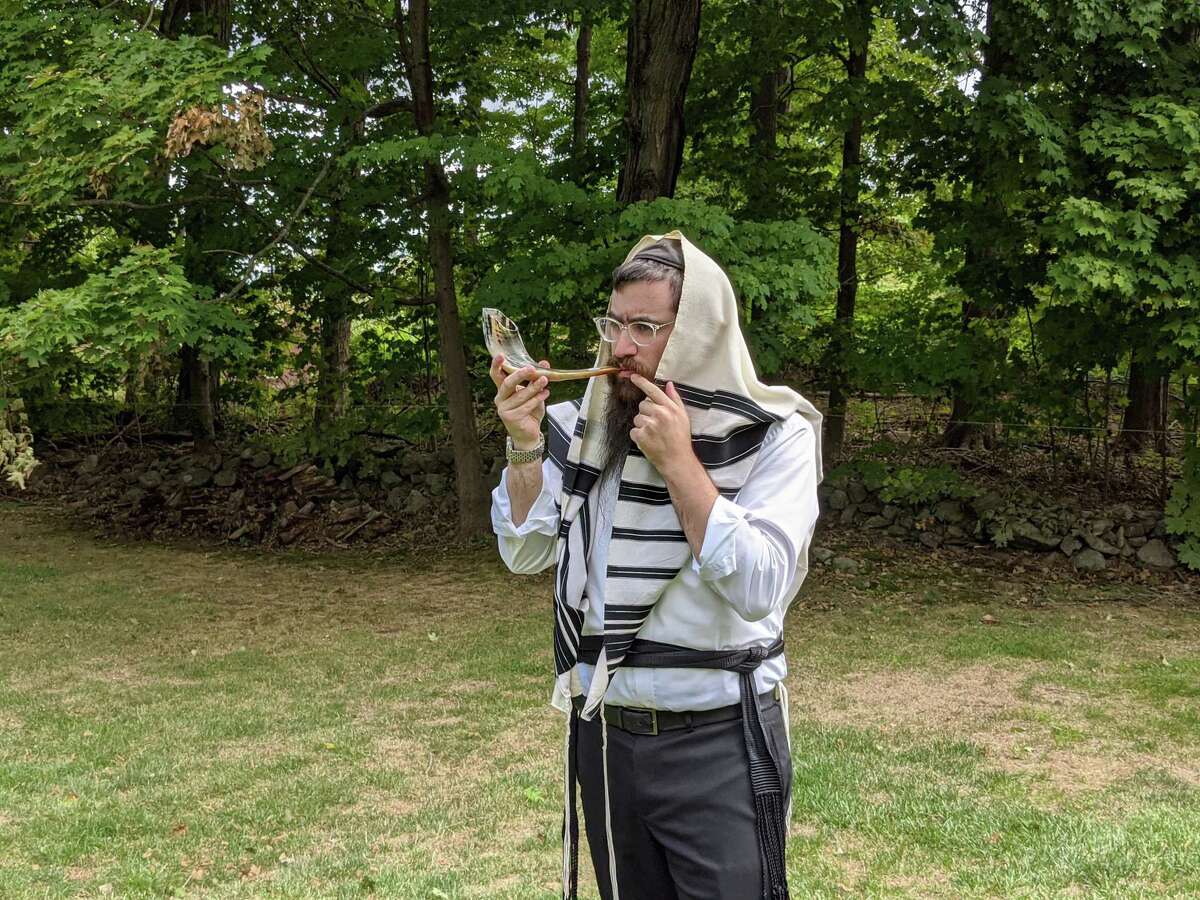 Rabbi Shneur Brook of the Chabad of Shelton and Monroe blowing the shofar. Chabad of Shelton and Monroe will hold an outdoor Rosh Hashanah service on Sunday, Sept. 20, at 4 p.m. on the Huntington Green in Shelton.
