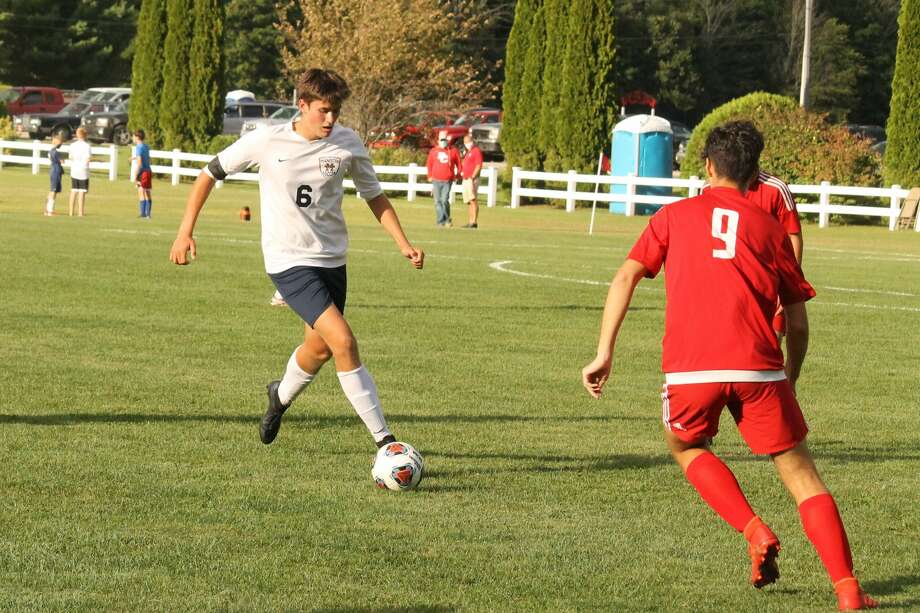 Manistee's Caleb Adamski looks to send the ball upfield during the second half of Manistee's 5-0 win over Benzie Central on Sept. 3. Photo: Robert Myers/News Advocate