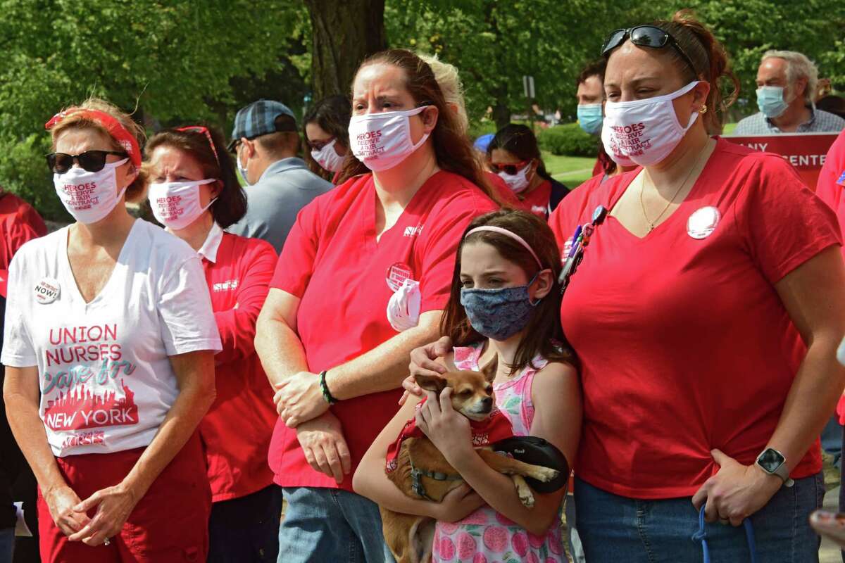 Healthcare workers and their families listen as supporters of New York State Nurses Association speak during a rally in front of Albany Medical Center to help nurses fight for a fair contract on Monday, Sept. 7, 2020 in Albany, N.Y (Lori Van Buren/Times Union)