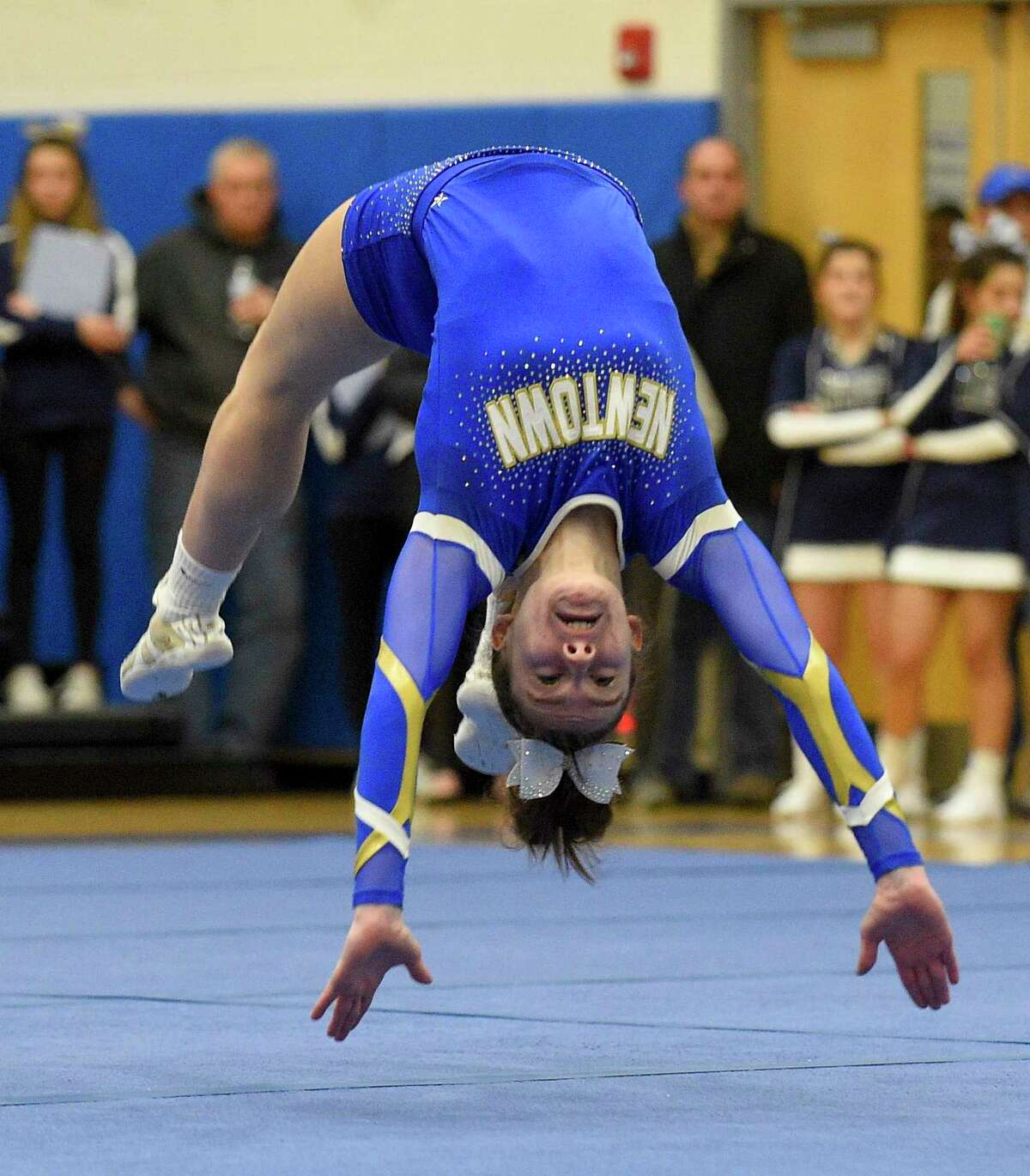 Newtown's Nikki Shairer does a flip during the SWC cheer championships at Newtown High School on Feb. 7.