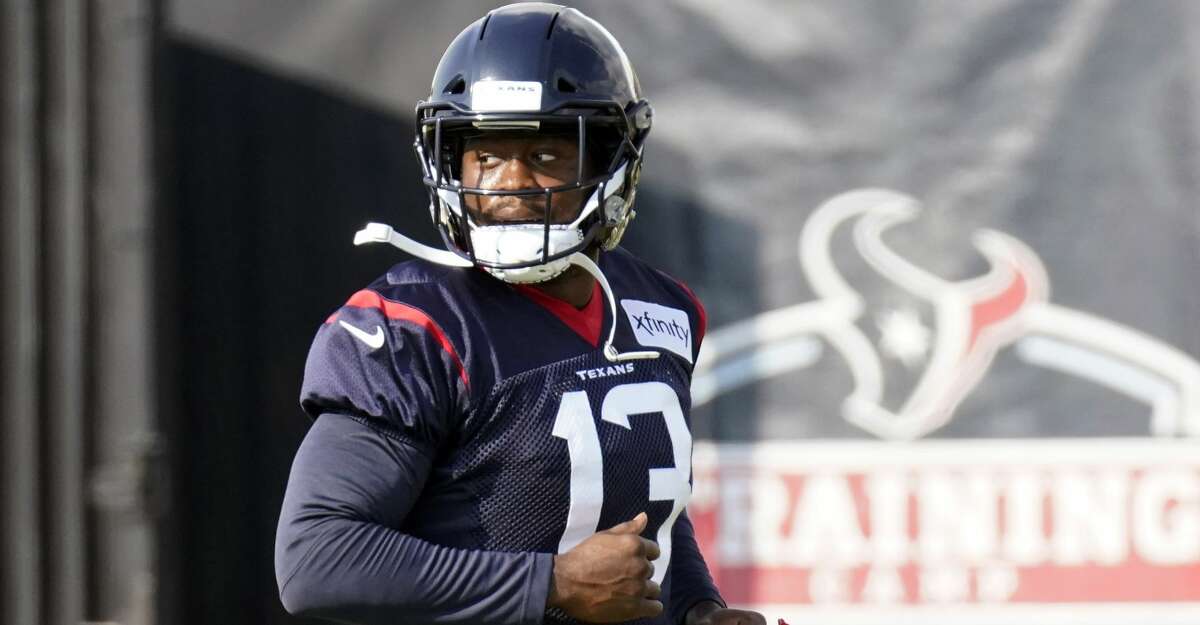 Houston Texans wide receiver Brandin Cooks (13) stretches during an NFL training camp football practice Friday, Aug. 21, 2020, in Houston. (AP Photo/David J. Phillip)