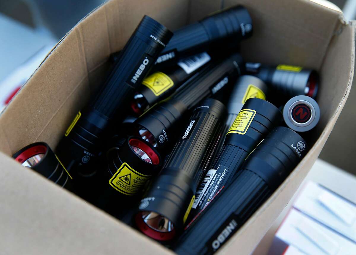 High powered flashlights are distributed to residents affected by the extended power outage at the PG&E community resource center at the Solano County Fairgrounds as the public safety power shutoff issued by the utility company continues for a third consecutive day in Vallejo, Calif. on Tuesday, Oct. 29, 2019.