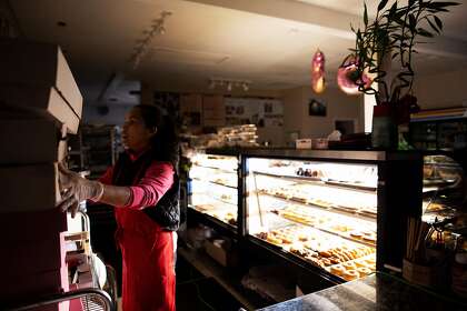 Sophia Neang working at The Donut Cafe during the PG&amp;E power shutoffs, Santa Rosa, California, October 10th, 2019. As many as 172,000 customers across the state could lose power early this week as the utility responds to forecasts of intense winds amid an extreme fire risk.