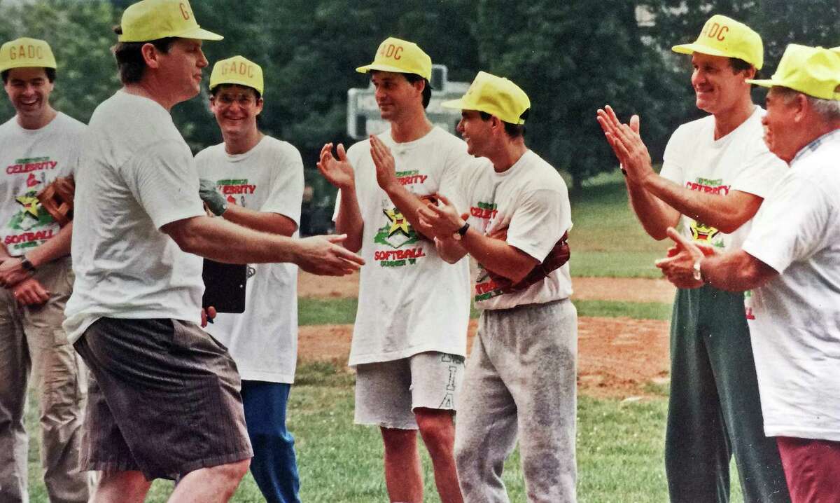 Baseball Hall of Famer Tom Seaver greets players at a charity softball game he hosted to benefit the Greenwich Adult Day Care Center in June 1991. Former Greenwich First Selectman John Margenot is at far right. Seaver, who lived for many years in Greenwich, died Monday at age 75.