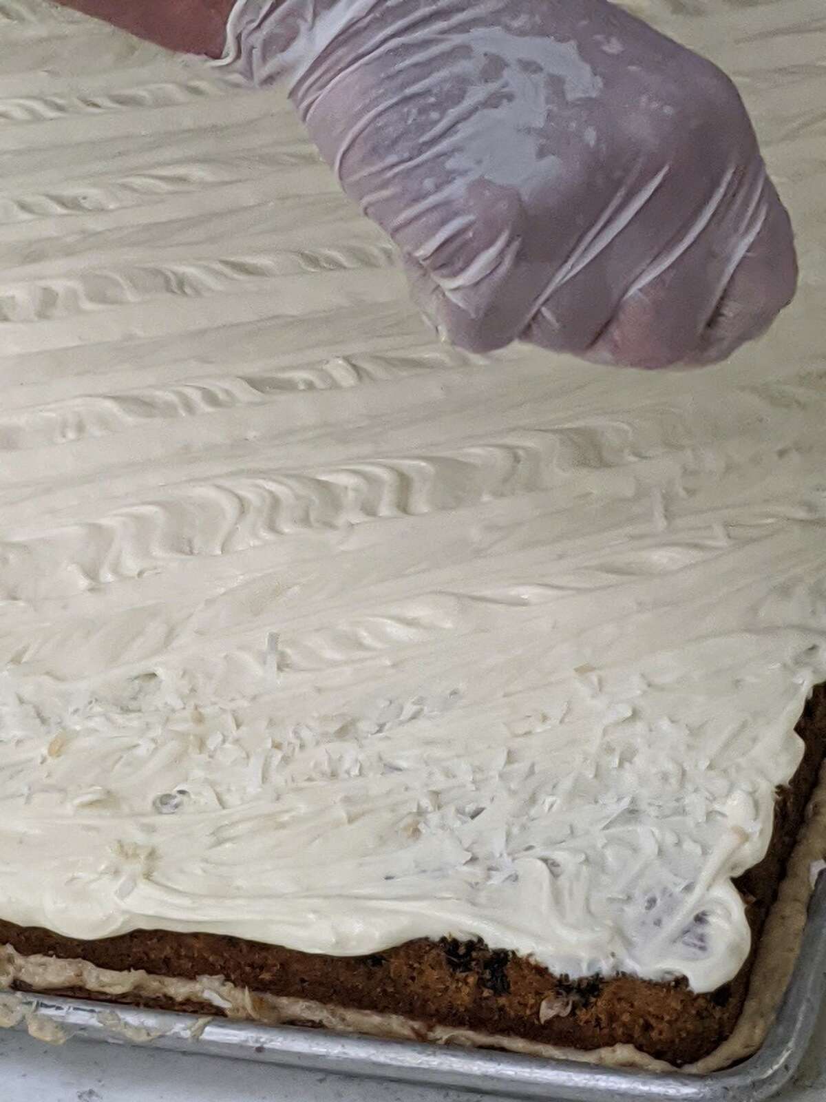 Frosting the carrot cake. (Provided)