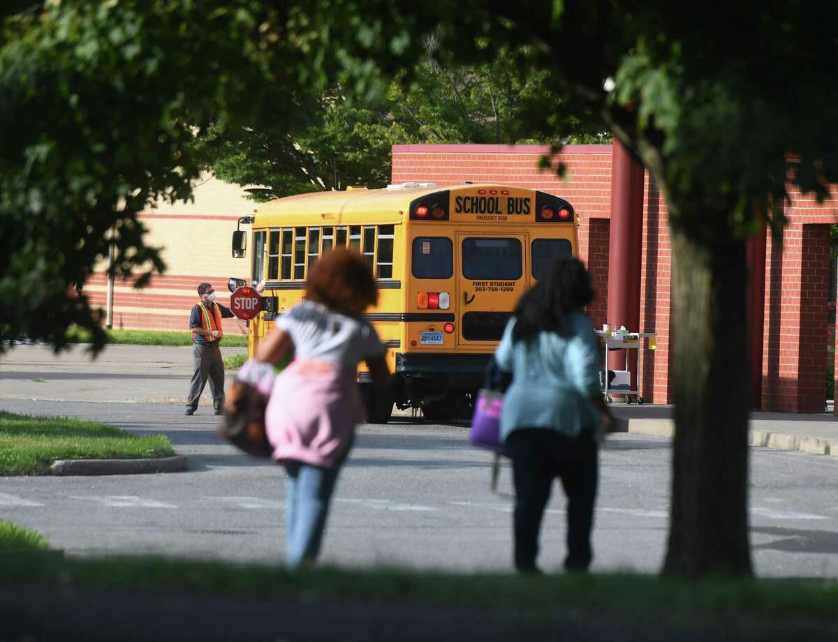 Students enter school on the first day of the 2020-2021 school year at Westover Elementary School in Stamford, Conn. Tuesday, Sept. 8, 2020.