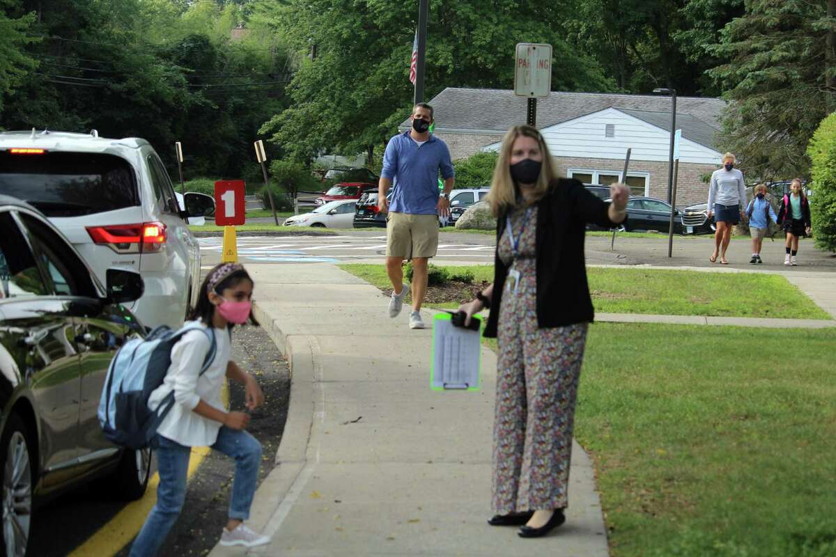Coleytown Elementary School principal Janna Sirowich helped welcome students on their first day back at school. Taken Sept. 8, 2020 in Westport, Conn.
