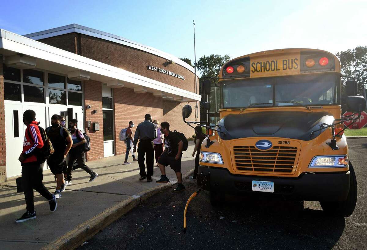 Students arrive for the first day of classes at West Rocks Middle School in Norwalk, Conn. on Tuesday, September 8, 2020.