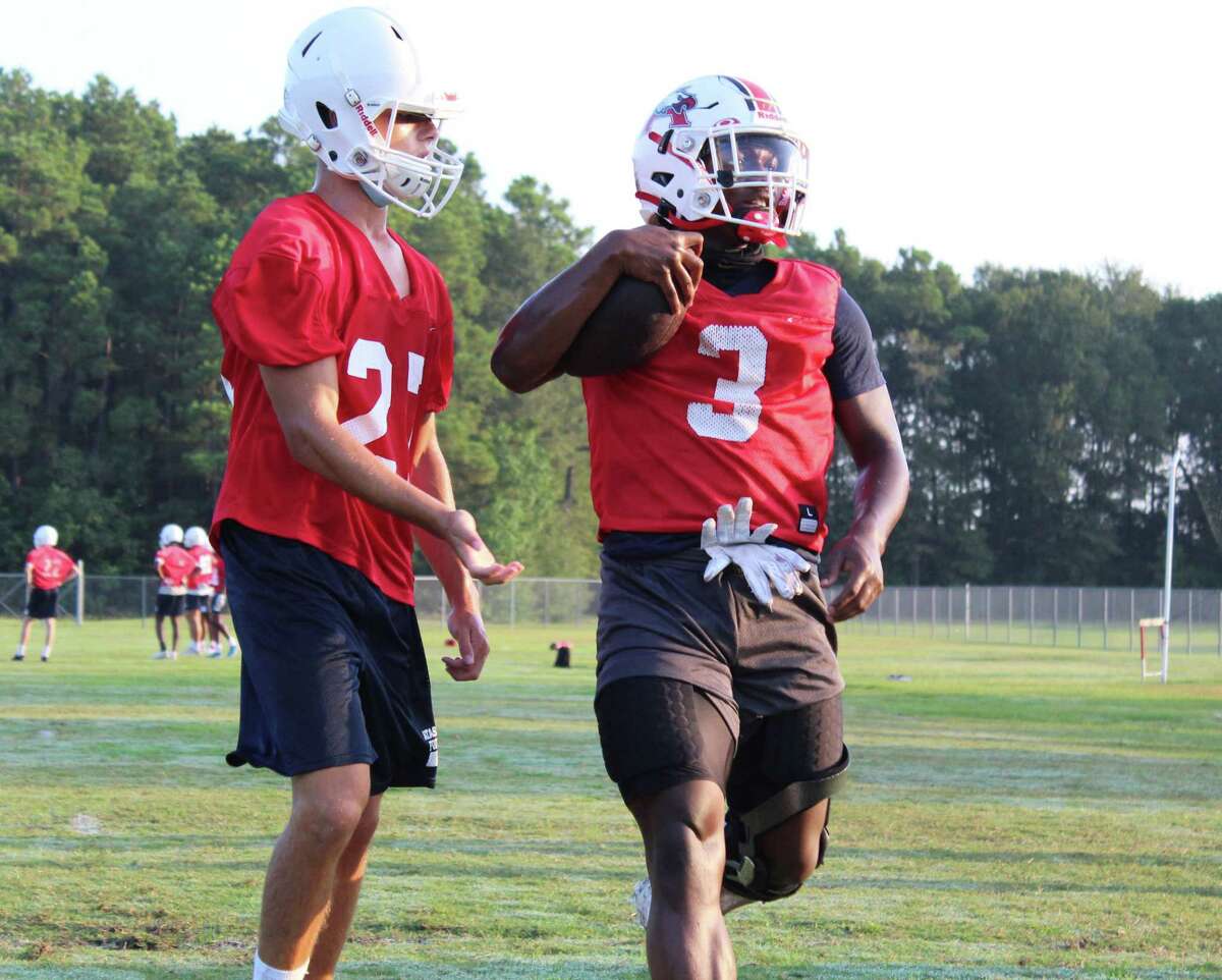 Atascocita senior running back Quiny Thompson does a drill on the first day of practice to open fall camp.