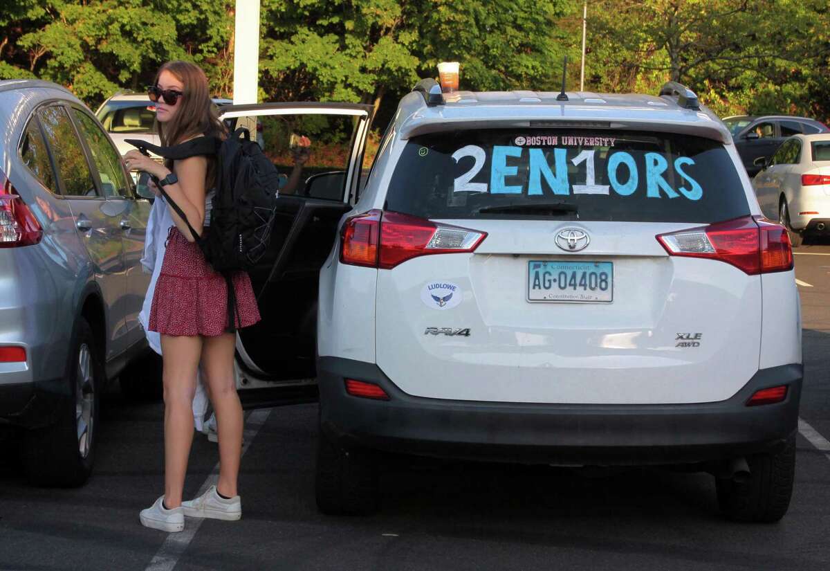 Fairfield Ludlowe High School students arrive for the first day of school for Fairfield Public Schools in Fairfield, Conn., on Tuesday Sept. 8, 2020.