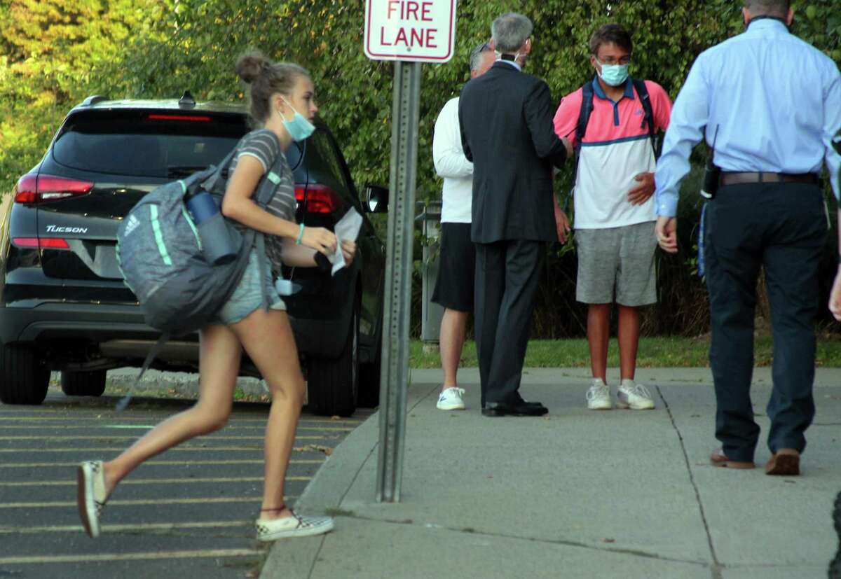 Fairfield Ludlowe High School students arrive for the first day of school for Fairfield Public Schools in Fairfield, Conn., on Tuesday Sept. 8, 2020.