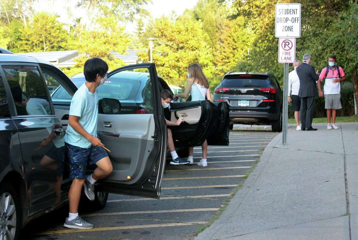 Fairfield Ludlowe High School students arrive for the first day of school for Fairfield Public Schools in Fairfield, Conn., on Tuesday Sept. 8, 2020.