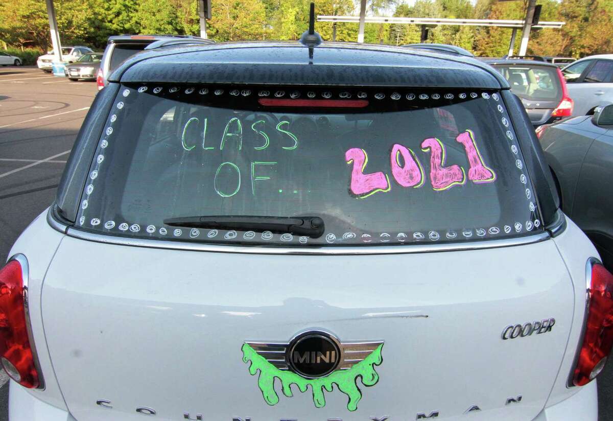 Fairfield Ludlowe High School students arrive for the first day of school for Fairfield Public Schools in Fairfield, Conn., on Tuesday Sept. 8, 2020.