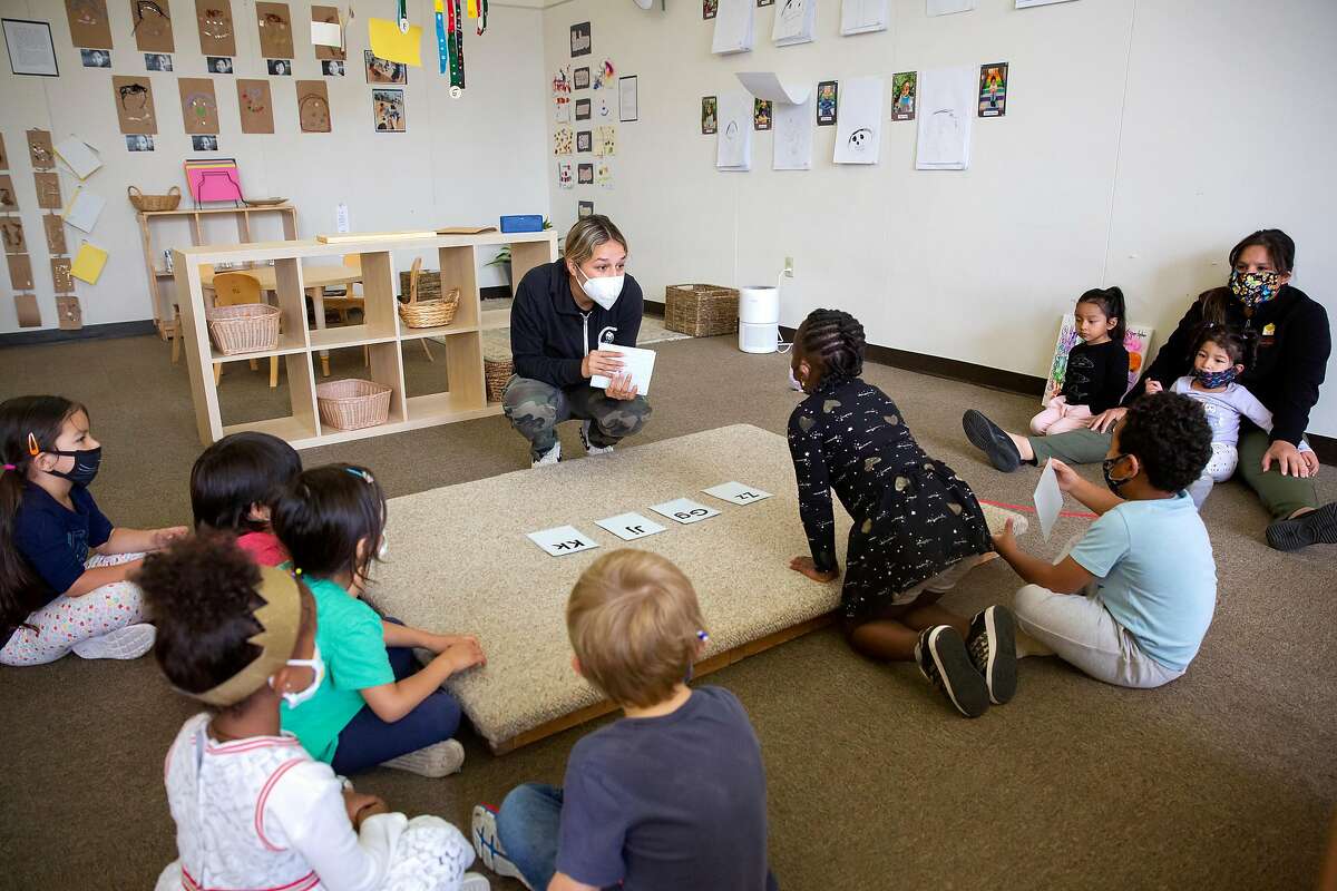 Holy Family Day Home teacher Bianca Carmelino leads an exercise with her preschool and kindergarten aged students at Holy Family Day Home in San Francisco, Calif. on September 3, 2020. Like many preschools, Holy Family Day Home is incorporating a kindergarten program into it's preschool system in order to meet demand from parents unable to supervise distance learning for their children at home.