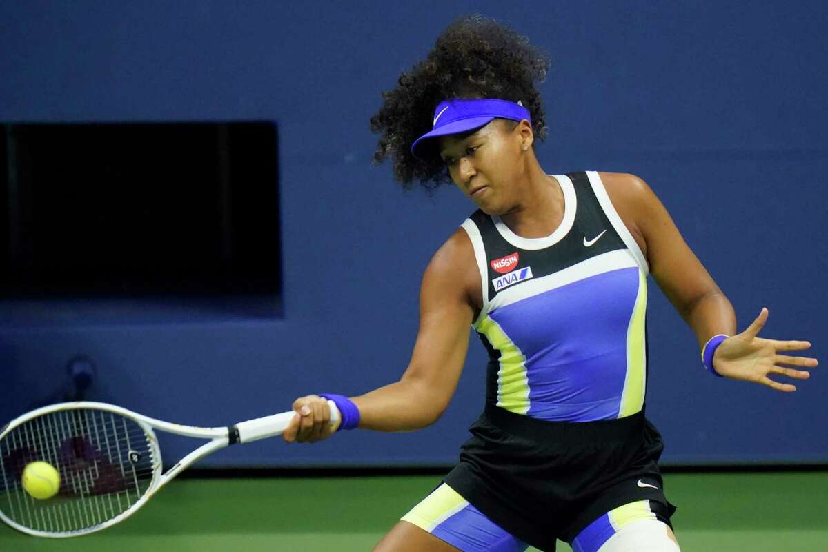 Naomi Osaka, of Japan, returns to Shelby Rogers, of the United States, during the quarterfinal round of the US Open tennis championships, Tuesday, Sept. 8, 2020, in New York. (AP Photo/Frank Franklin II)