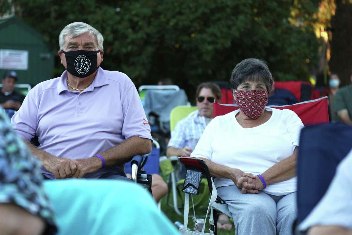 Joe and Bev Valiante of Westport watch the musicians at the KJD fundraiser concert on Sherman Green on Saturday, Sept. 5, 2020, in Fairfield, Conn.